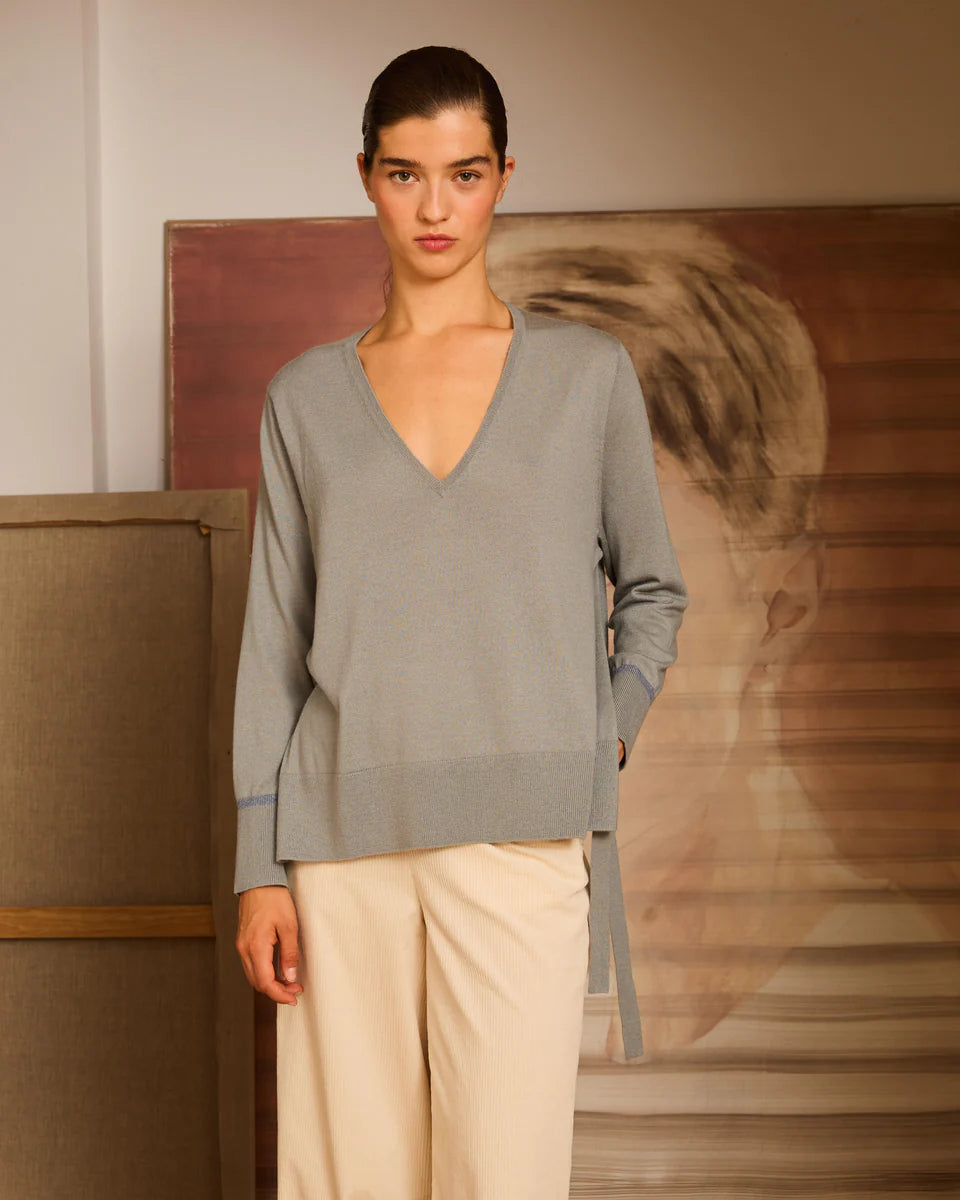 Jersey aguamarina de pico con lazadas